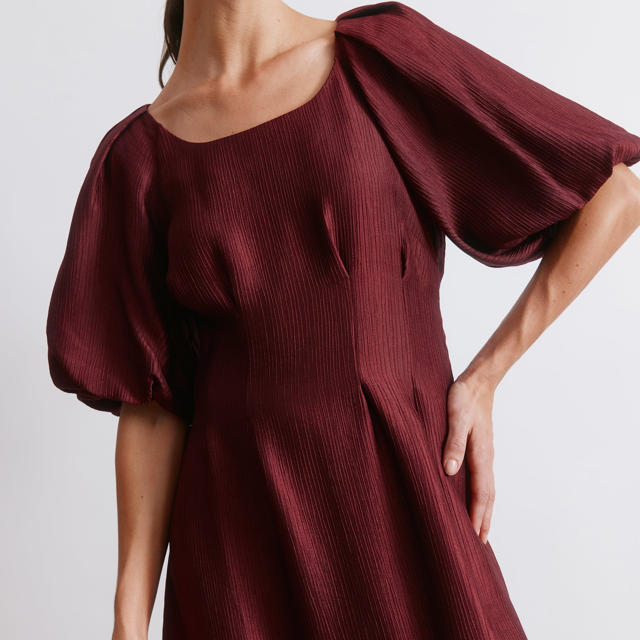 Burgundy satin party dress styled as a chic occasion midi outfit  