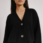 Black wool blend cardigan styled with front pockets for everyday wear  