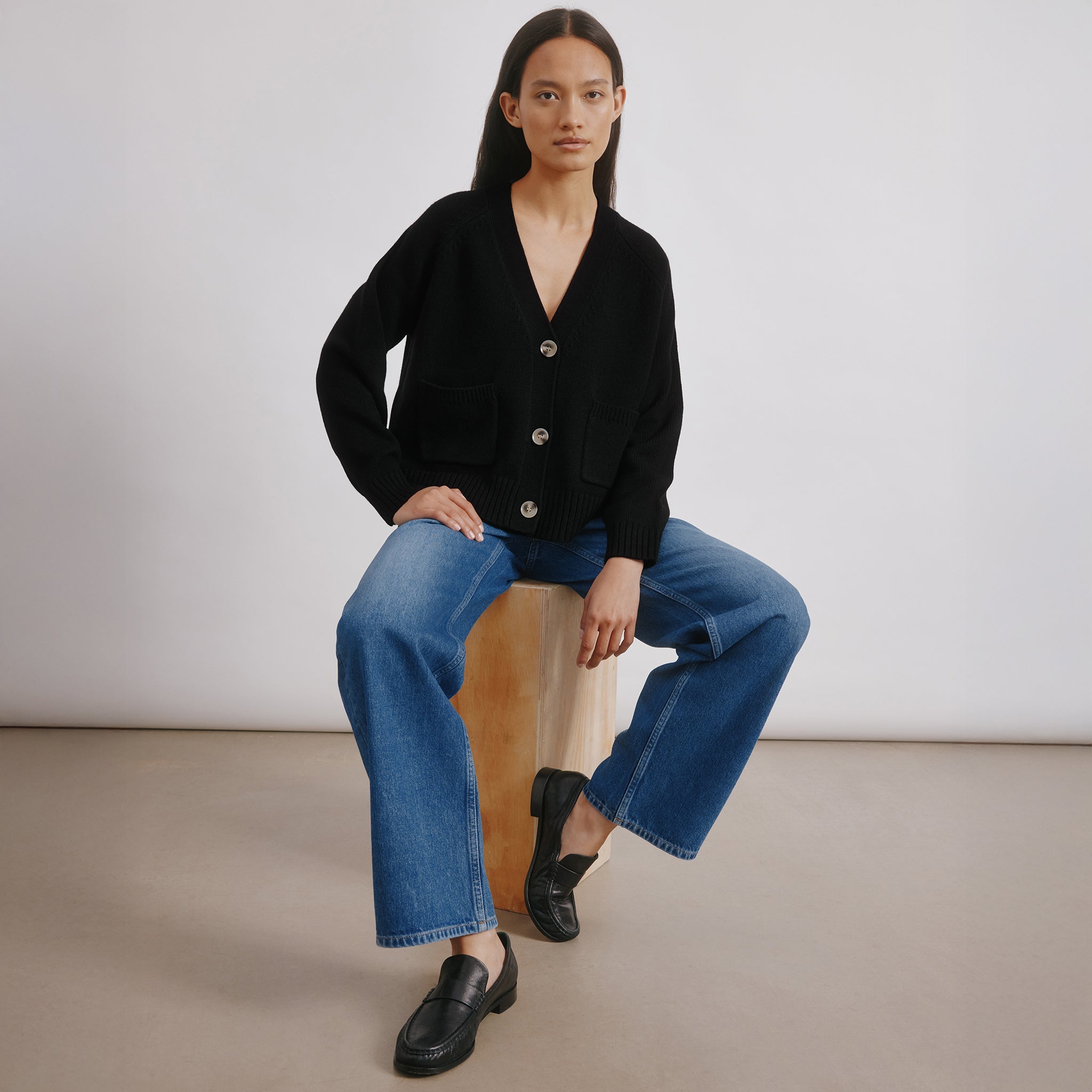 Timeless black cardigan in soft knit fabric with versatile layering fit  