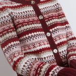 Burgundy fair isle knit styled as a short cosy wool cardigan  