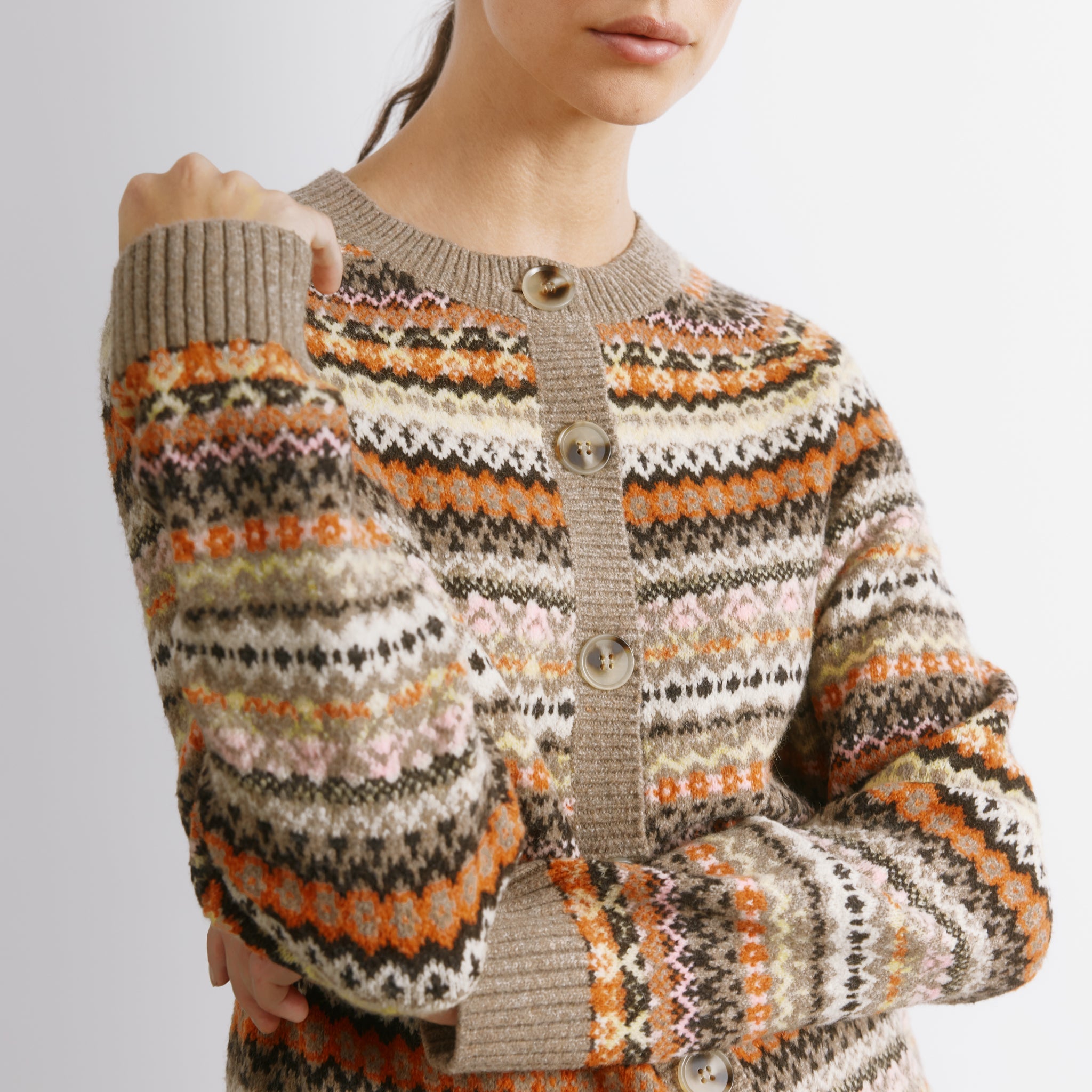 Traditional fair isle cardigan styled as a cosy neutral knitwear layer  