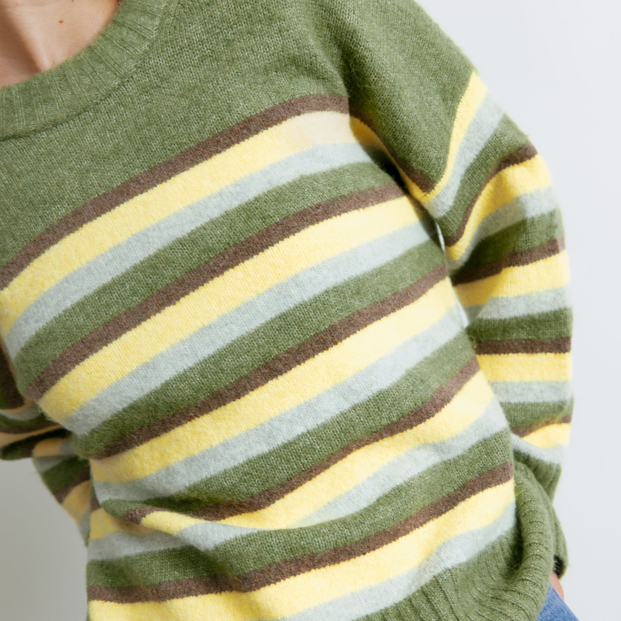 Multicolour striped knit featuring green, brown and lemon stripe pattern  