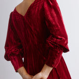 Long sleeve crushed velvet midi dress in a rich red tone, designed with puff sleeves and a fitted waist.  