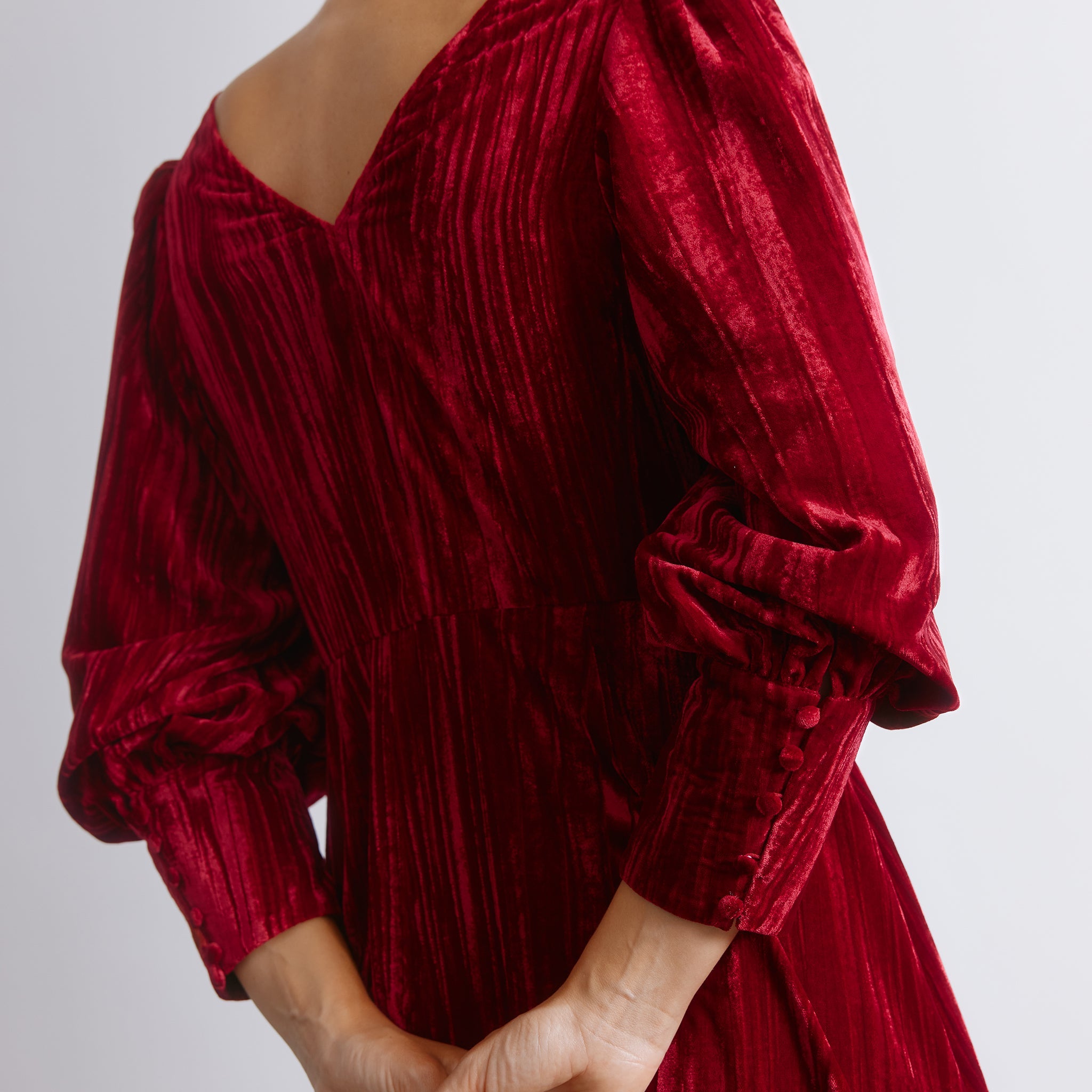 Long sleeve crushed velvet midi dress in a rich red tone, designed with puff sleeves and a fitted waist.  