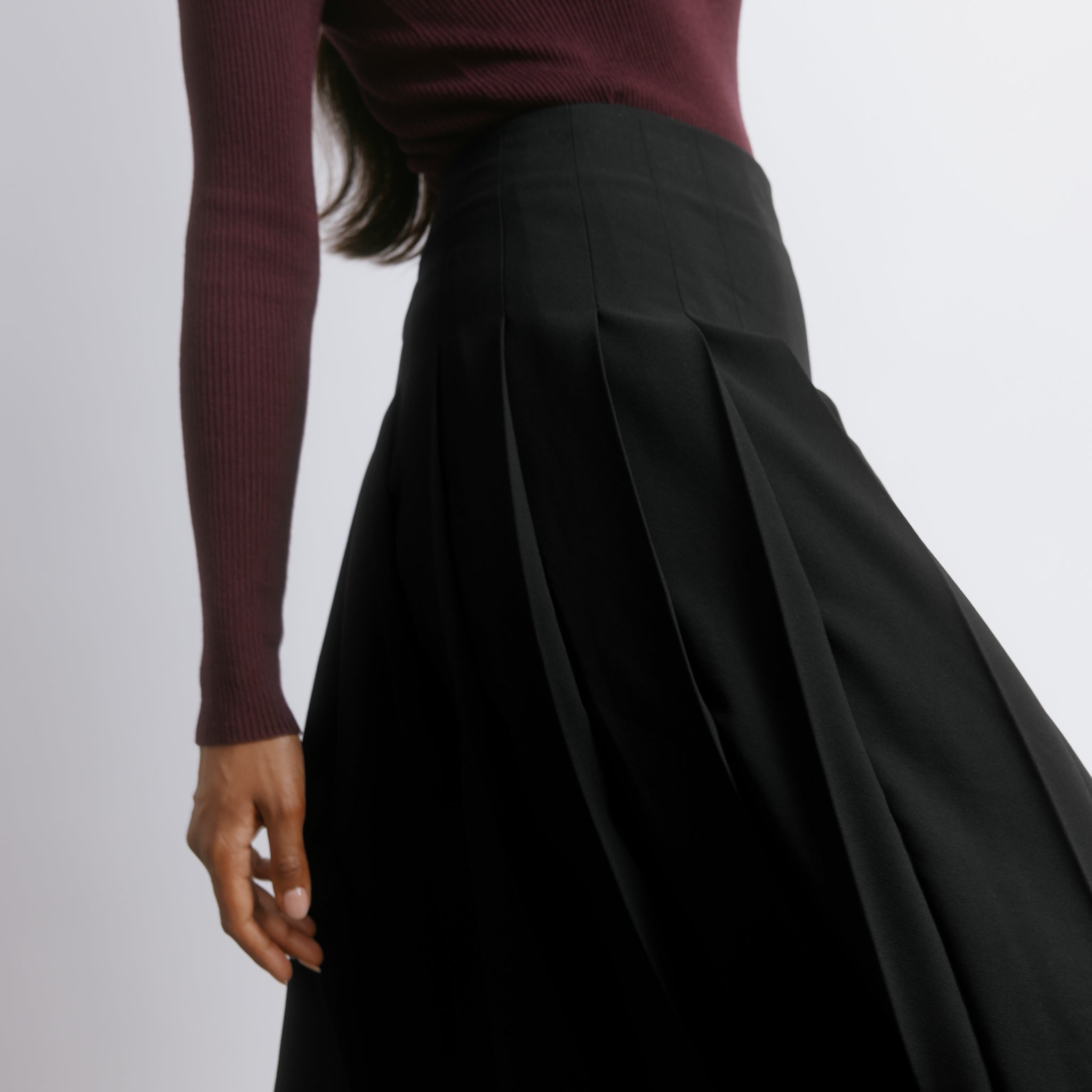 Eco friendly pleated midi skirt designed for timeless wear, crafted from lightweight recycled fabric.  