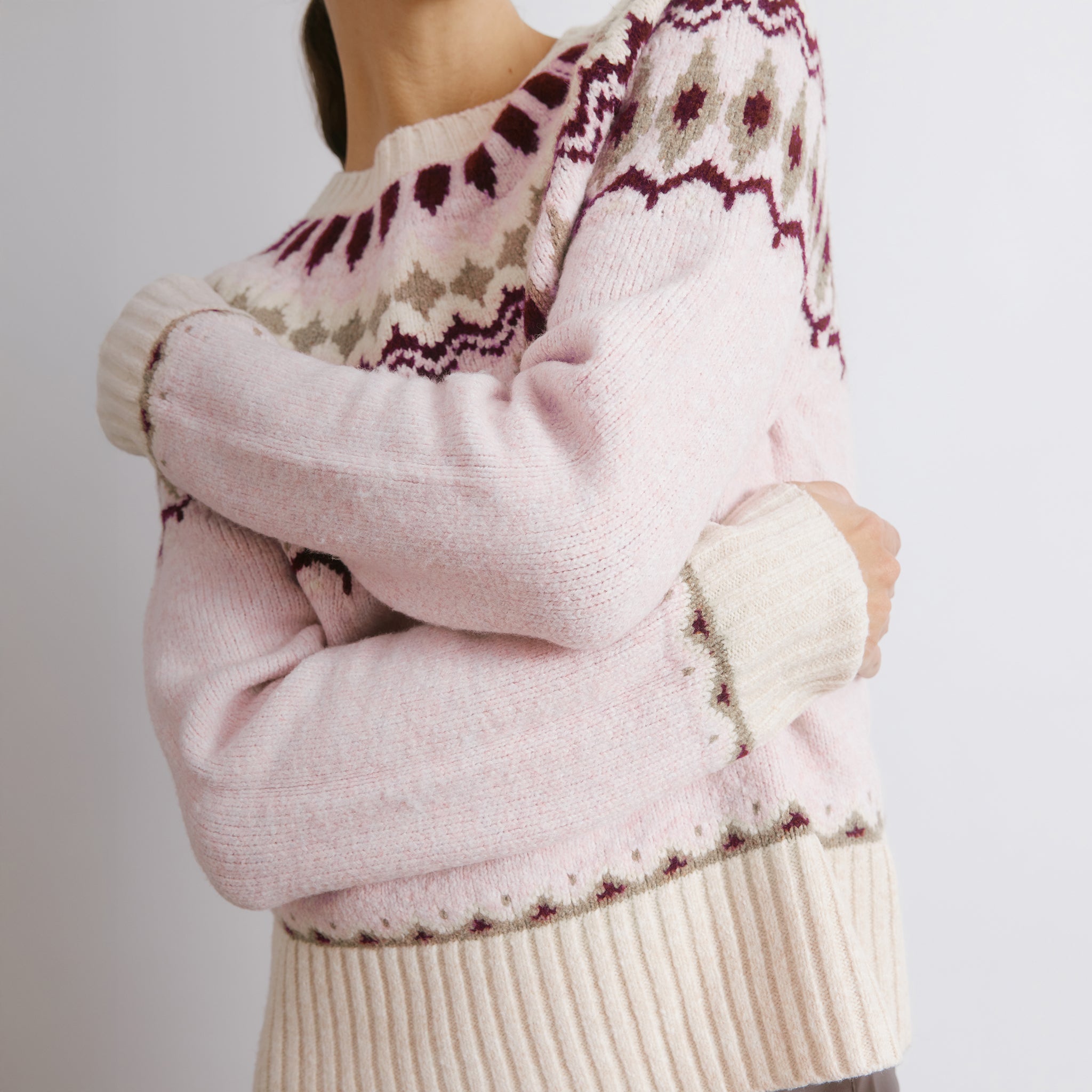 Fair isle knit jumper styled in soft pink wool with Nordic inspired pattern  