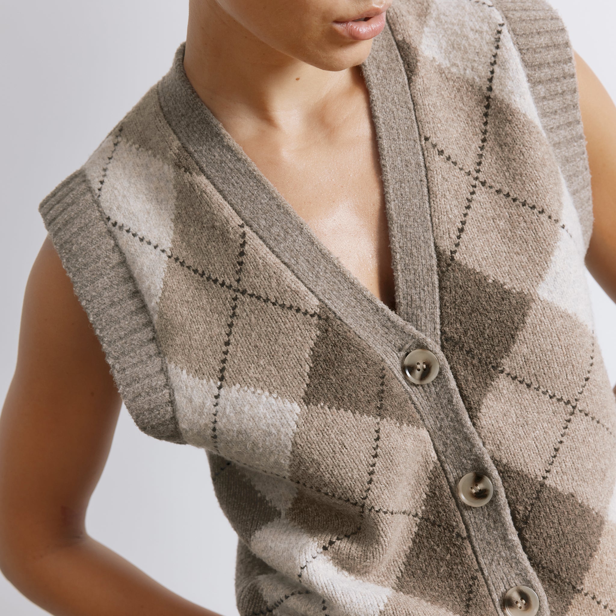 Knitted argyle vest styled as a sleeveless tank top in soft wool blend  