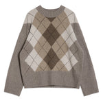 Argyle knit jumper styled as a cosy crew neck, versatile winter essential  