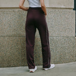 Burgundy track pants with straight leg jersey joggers, retro stripe detail on casual drawstring pants, organic cotton joggers ideal for sustainable and ethically made loungewear.