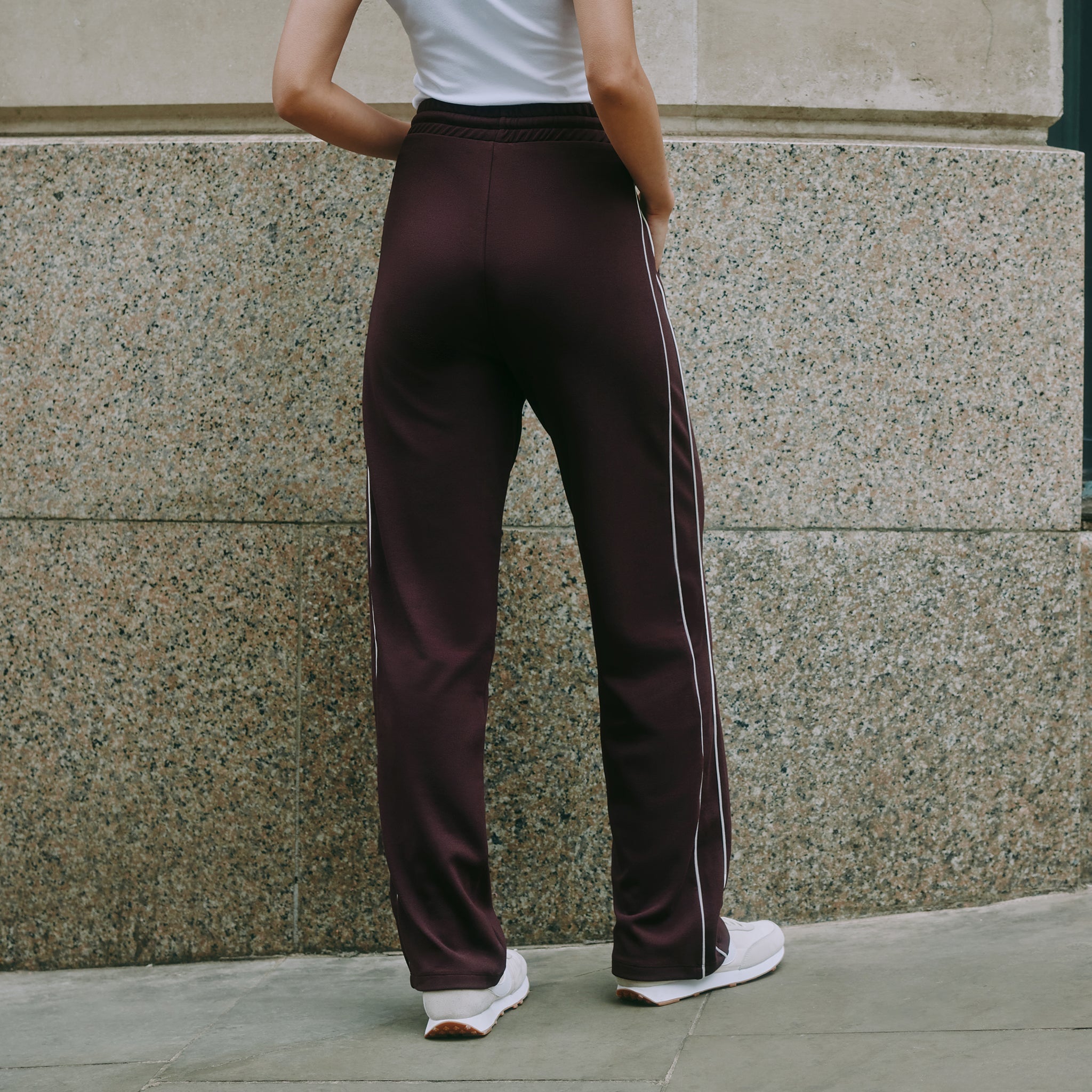 Burgundy track pants with straight leg jersey joggers, retro stripe detail on casual drawstring pants, organic cotton joggers ideal for sustainable and ethically made loungewear.
