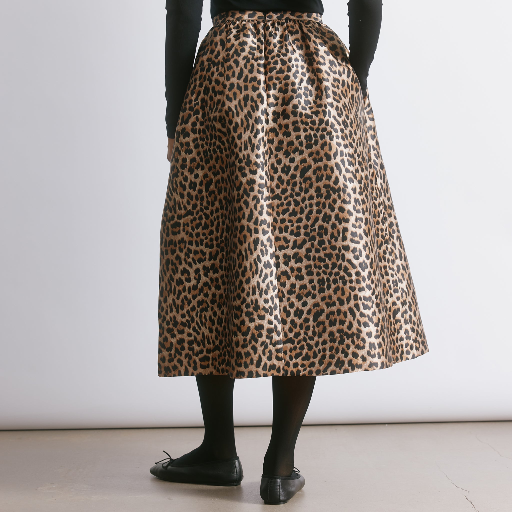 Animal print skirt crafted from structured taffeta with a voluminous full silhouette and midi length.  
