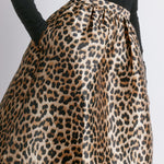 Bold printed midi skirt with an elegant flared shape, designed as a statement piece for special occasions.  