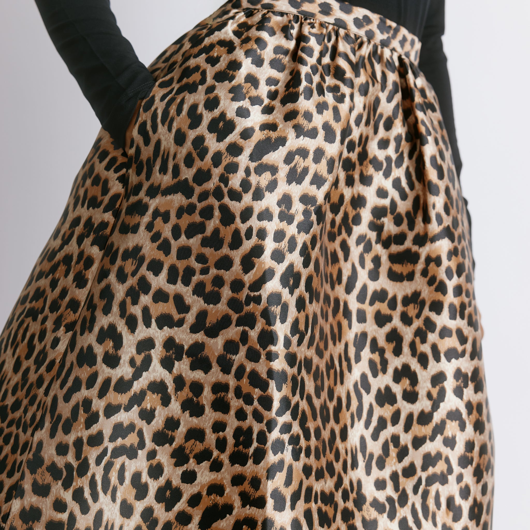 Bold printed midi skirt with an elegant flared shape, designed as a statement piece for special occasions.  