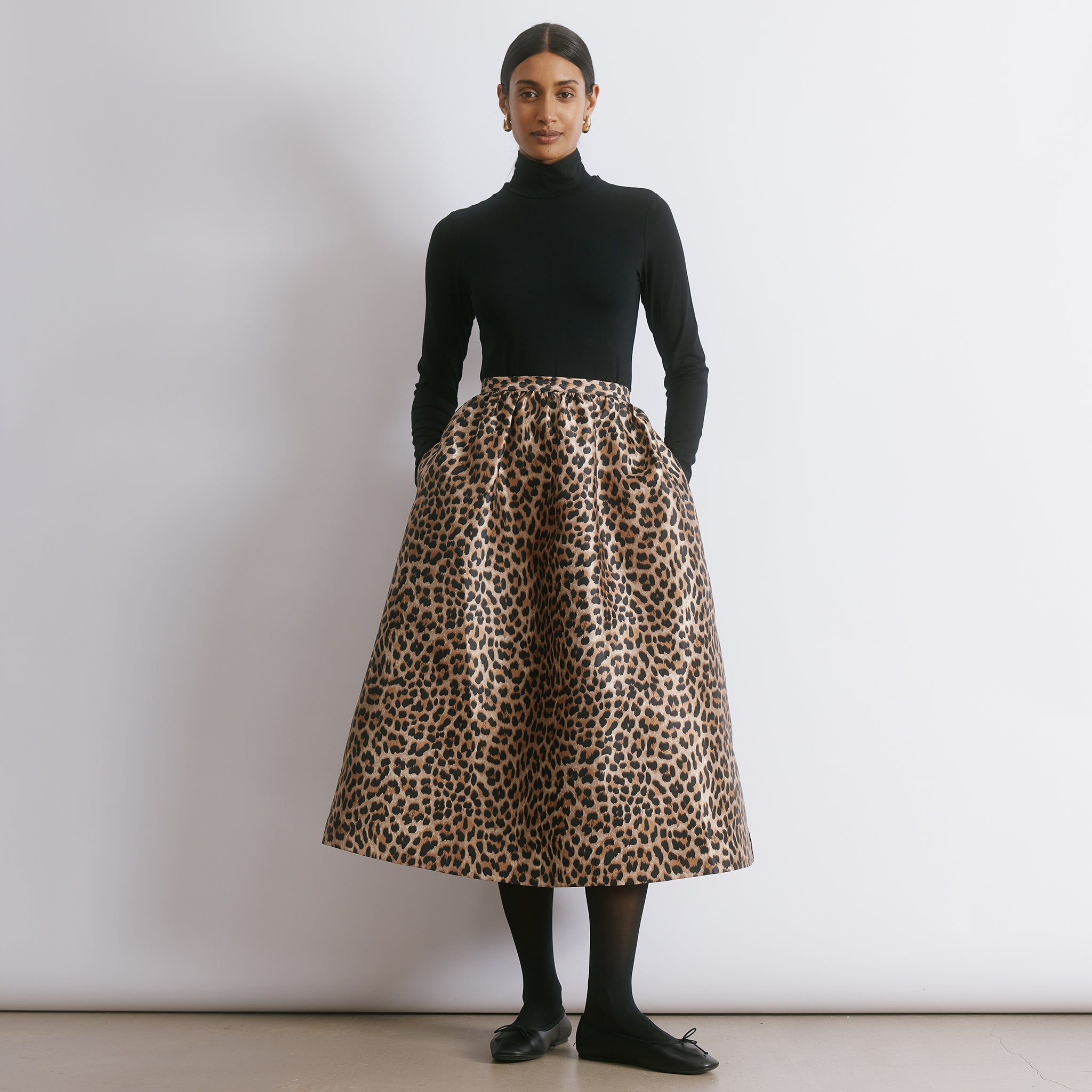 Lined animal print skirt featuring a dramatic volume and luxurious taffeta texture for evening wear.  