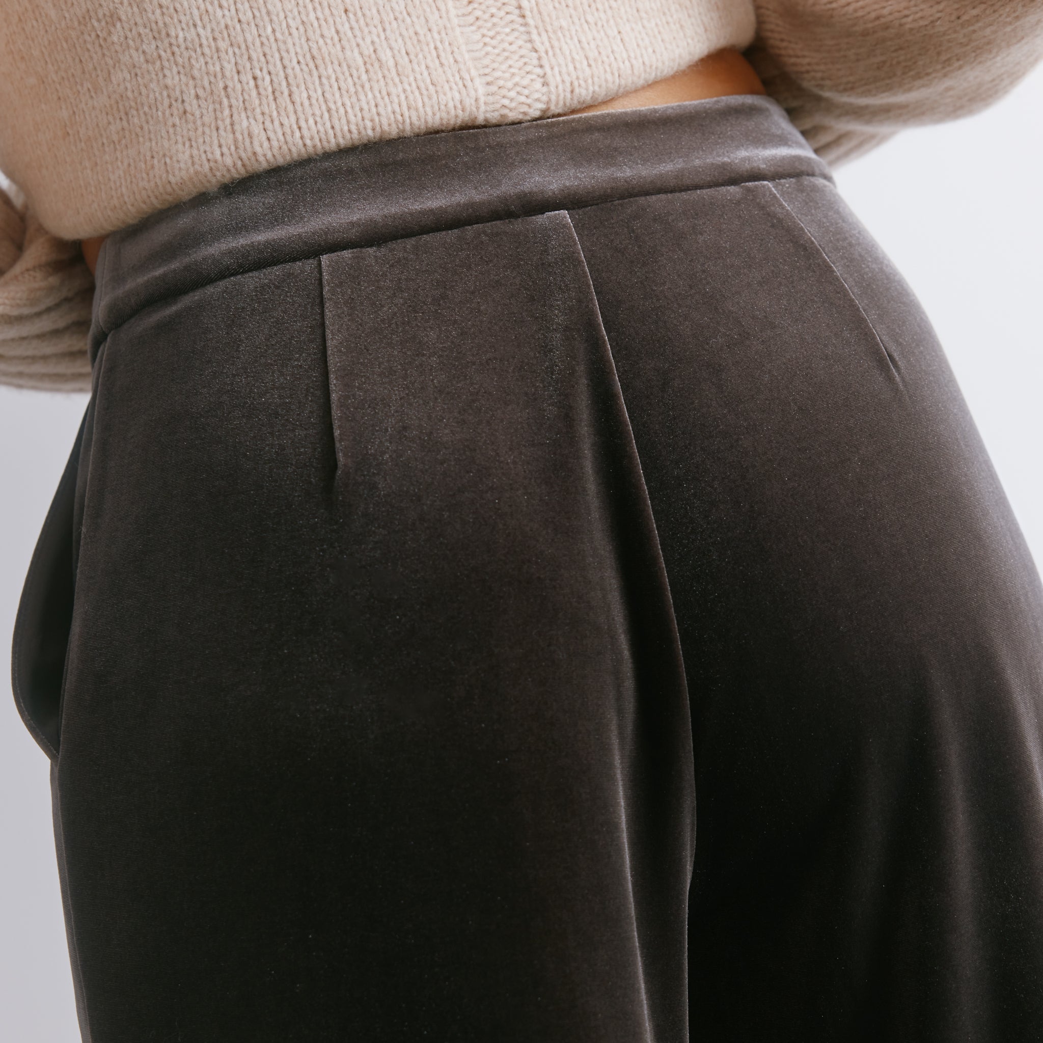 Plush mole velvet trousers featuring a statement wide leg silhouette for effortless occasion dressing.  