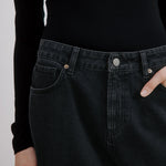 Black barrel leg jeans styled with casual white top, mid-rise relaxed fit and wide leg cropped silhouette, organic cotton and sustainable denim, ethically made for eco-conscious wardrobes