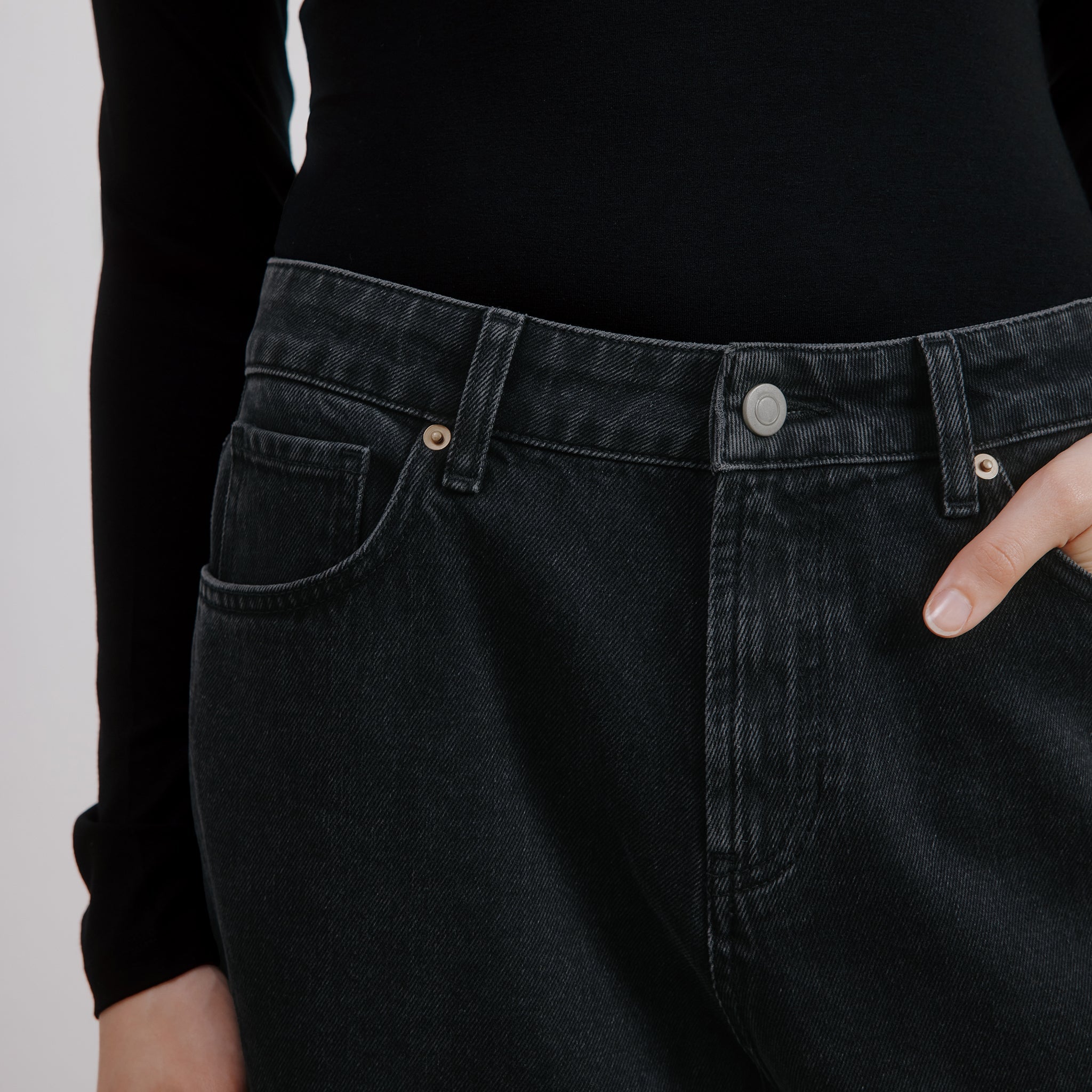 Black barrel leg jeans styled with casual white top, mid-rise relaxed fit and wide leg cropped silhouette, organic cotton and sustainable denim, ethically made for eco-conscious wardrobes