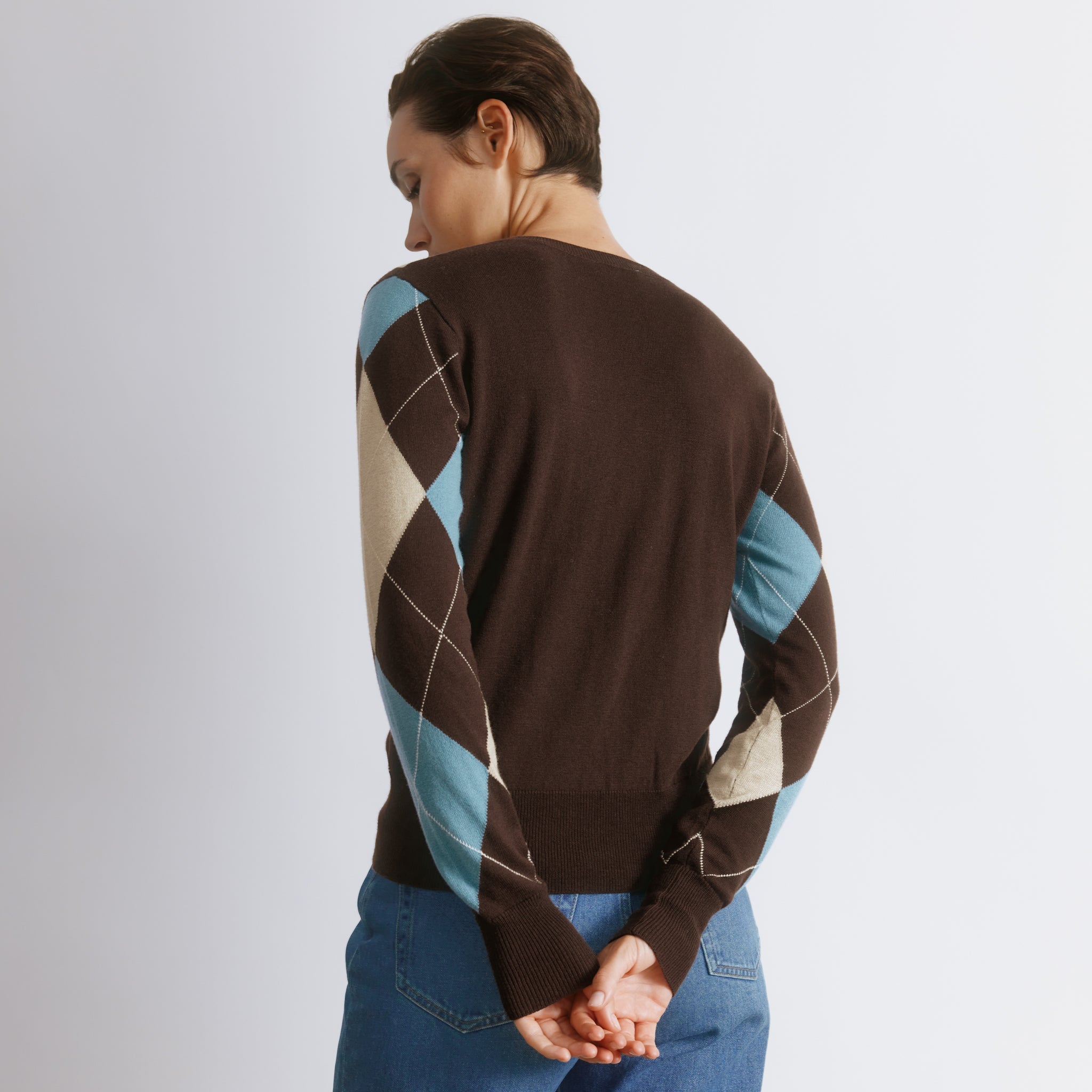 Blue argyle sweater in wool blend knit with classic crew neck design  