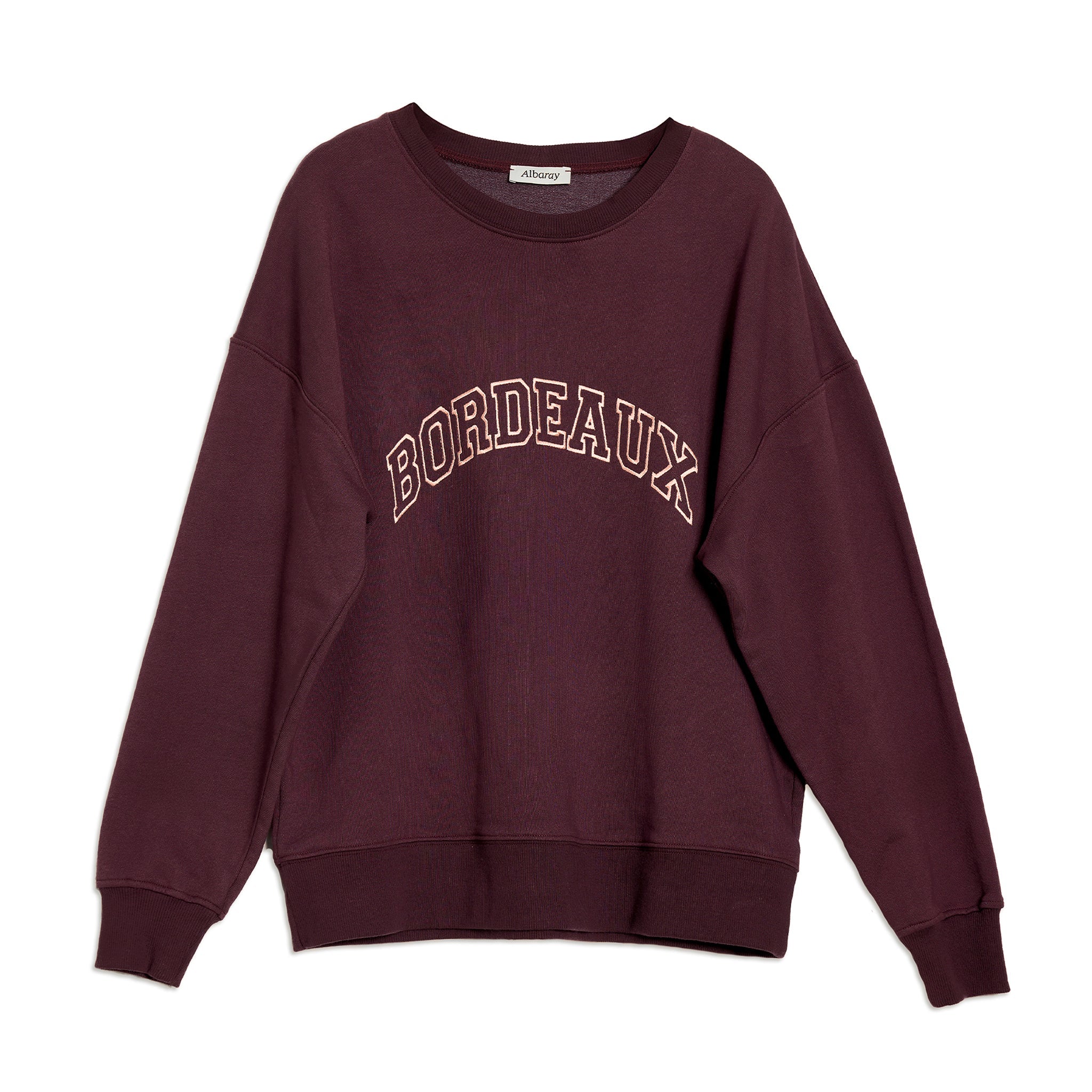 Stylish bordeaux embroidered sweatshirt featuring burgundy logo and crew neck, ideal for a conscious wardrobe essential.