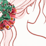 Soft oversized scrunchie in green with a delicate floral print, perfect for casual wear.
