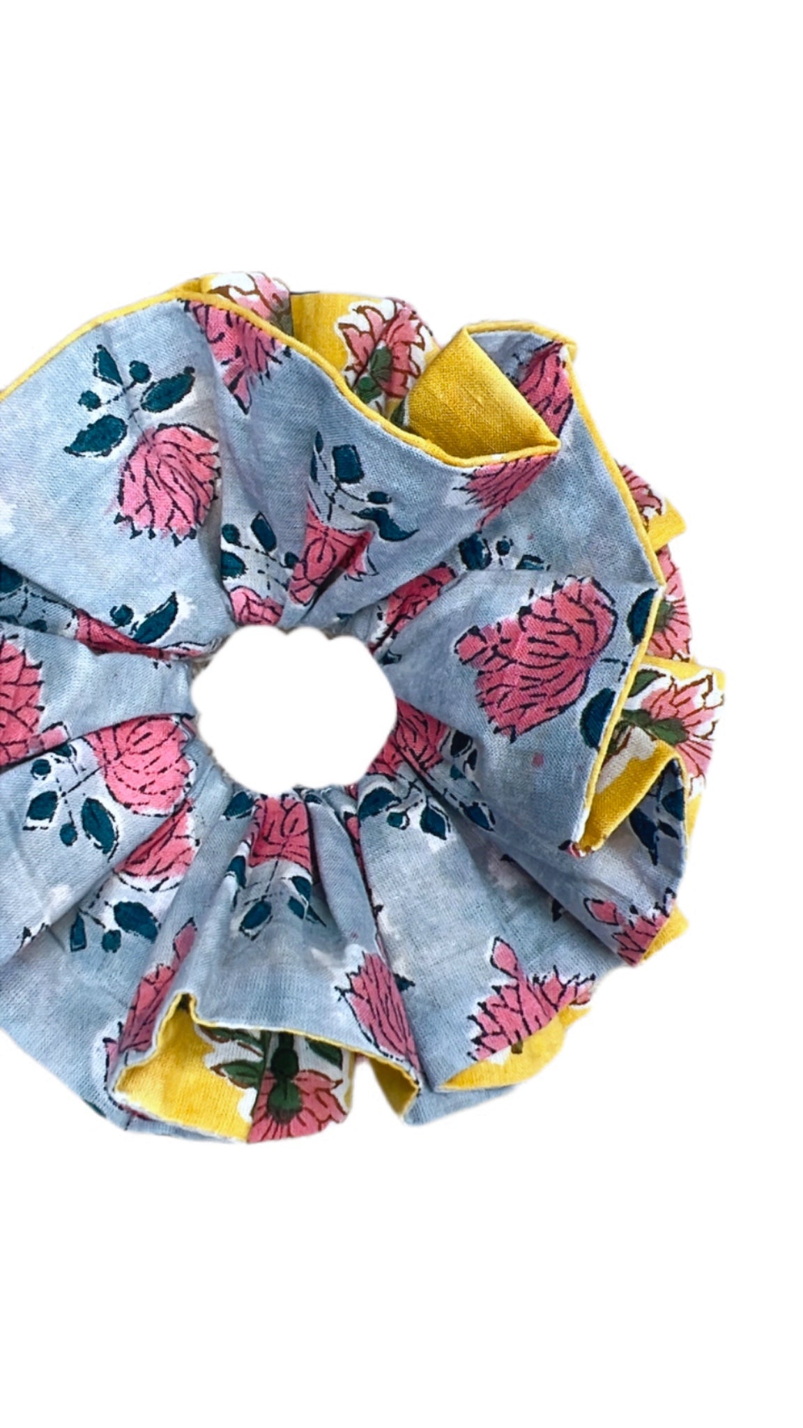 Large green scrunchie with floral design and textured fabric for a unique style.