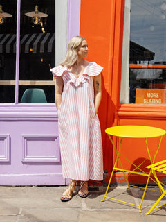 Stylish A-line maxi dress with V-neck and delicate ruffle neckline, perfect for summer.