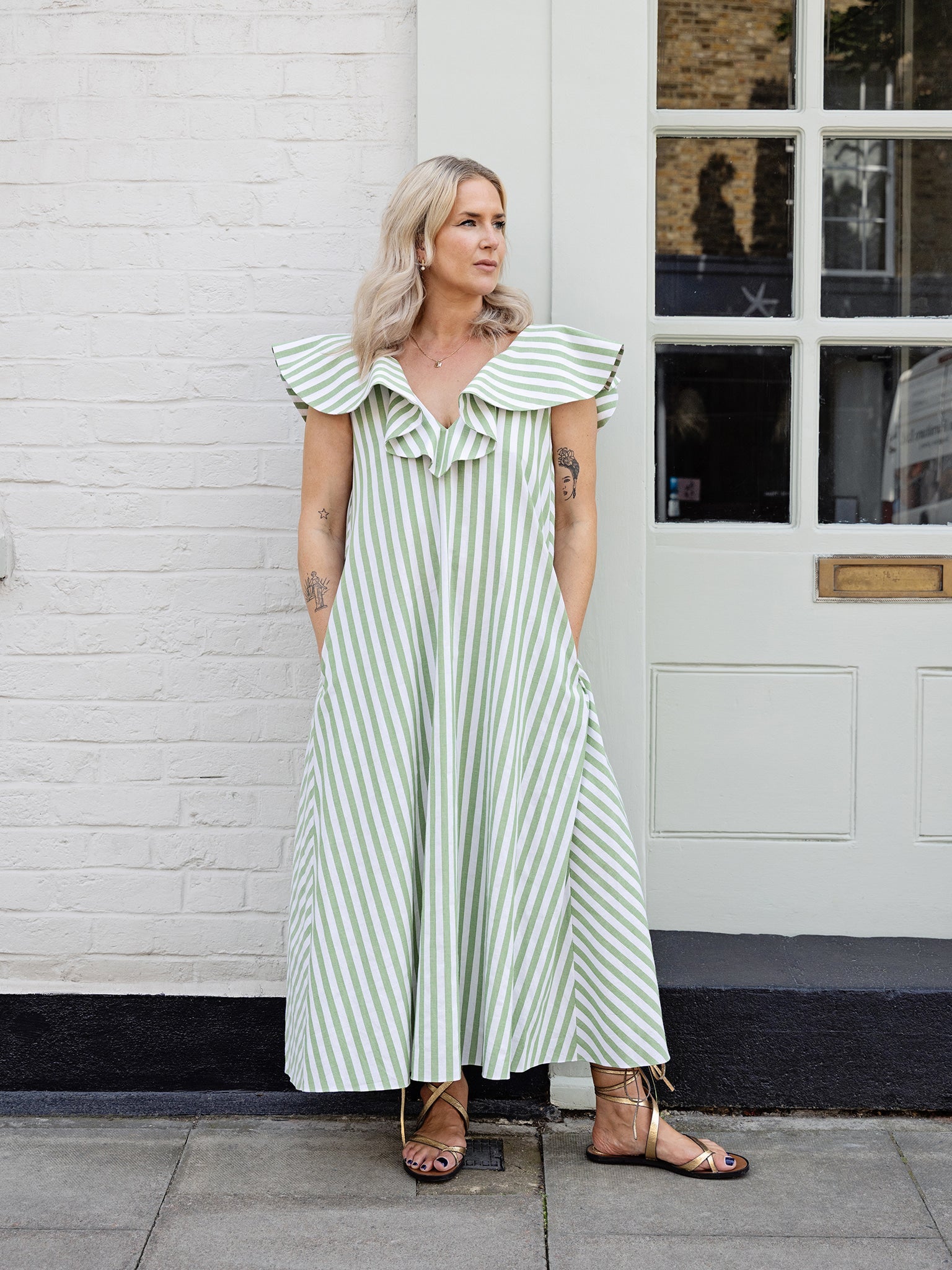 green stripe V-neck cotton summer dress with ruffle neckline and flattering A-line maxi silhouette.