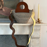 Brown suede basket bag with structured shape and upcycled leather trim.