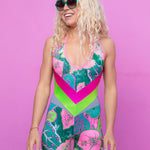 Stylish colourful sunglasses with green lenses and matching frame.
