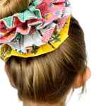 Floral print green scrunchie with an oversized design, ideal for adding color to hairstyles.