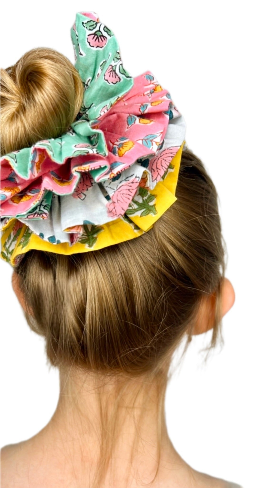 Floral print green scrunchie with an oversized design, ideal for adding color to hairstyles.