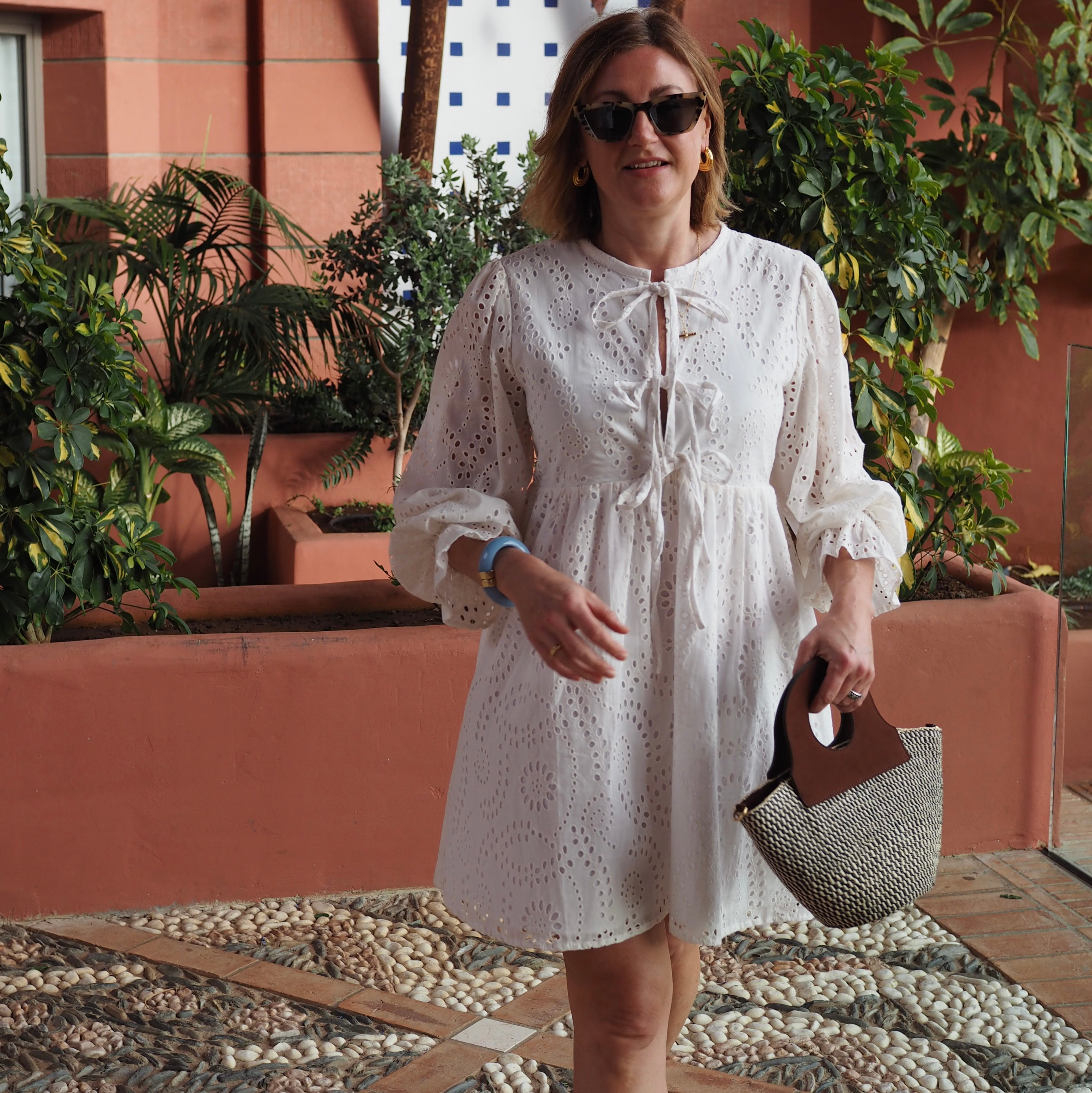 Stylish basket bag crafted from woven materials and upcycled leather.