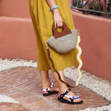 Basket bag with upcycled leather detailing in natural tones.