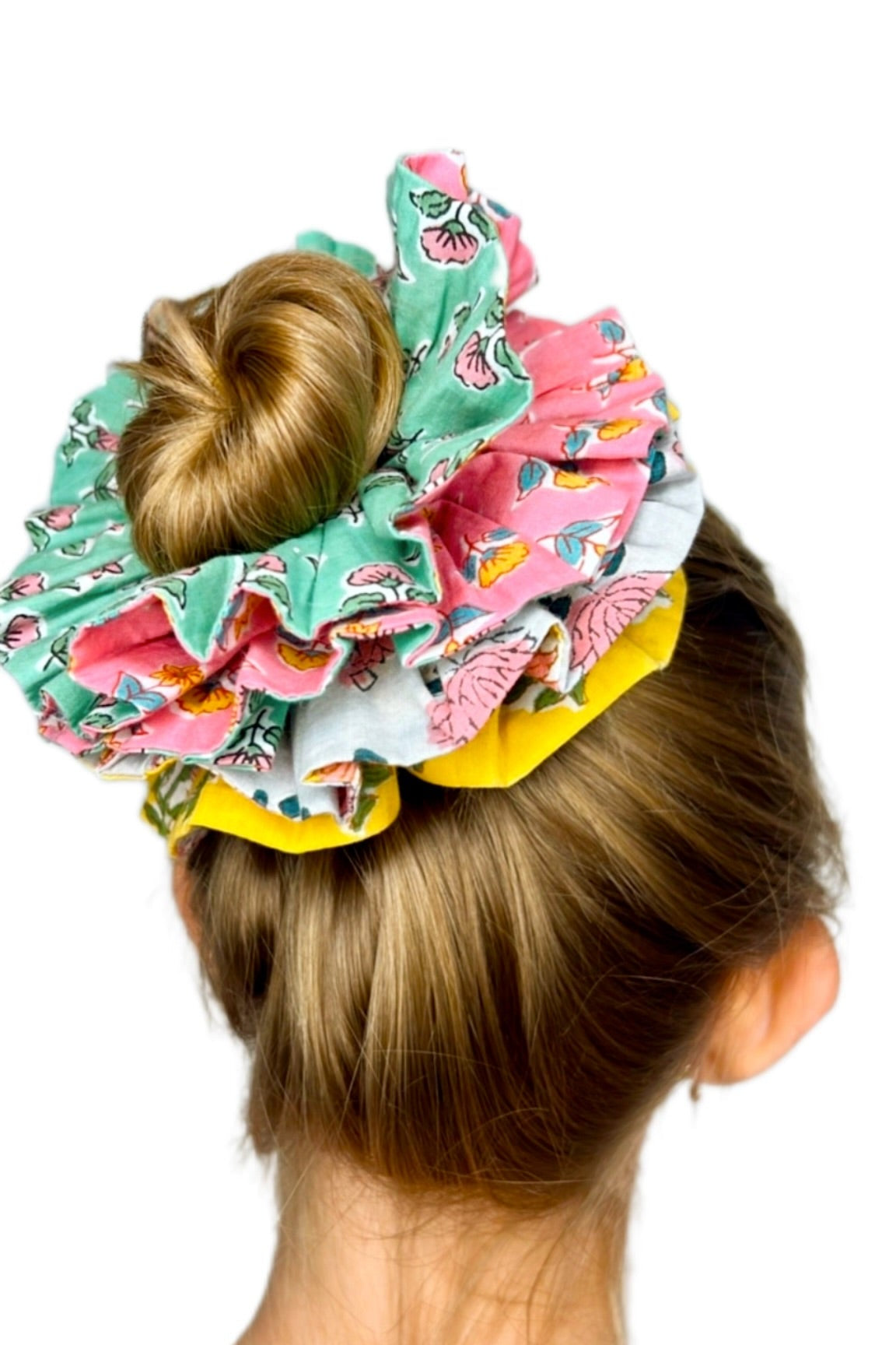 Floral green oversized scrunchie styled on hair for a casual, elegant look.