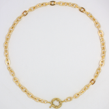 Close-up of gold plated chunky chain necklace highlighting the chunky front clasp.
