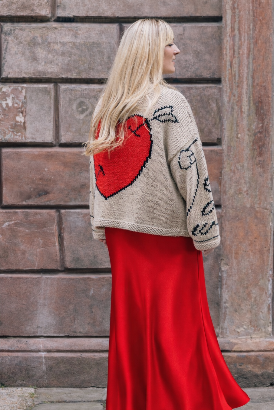 Slow Love Young Heart Jumper, flattering Red Satin Aldgate Skirt by Percy Langley. worn by journalist  Lauren Bravo