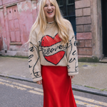 Slow Love Young Heart Jumper, flattering Red Satin Aldgate Skirt by Percy Langley. worn by fashion journalist and author Lauren Bravo