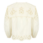 Elegant white blouse with long balloon sleeves, oversized collar, and embroidery along the cuffs.