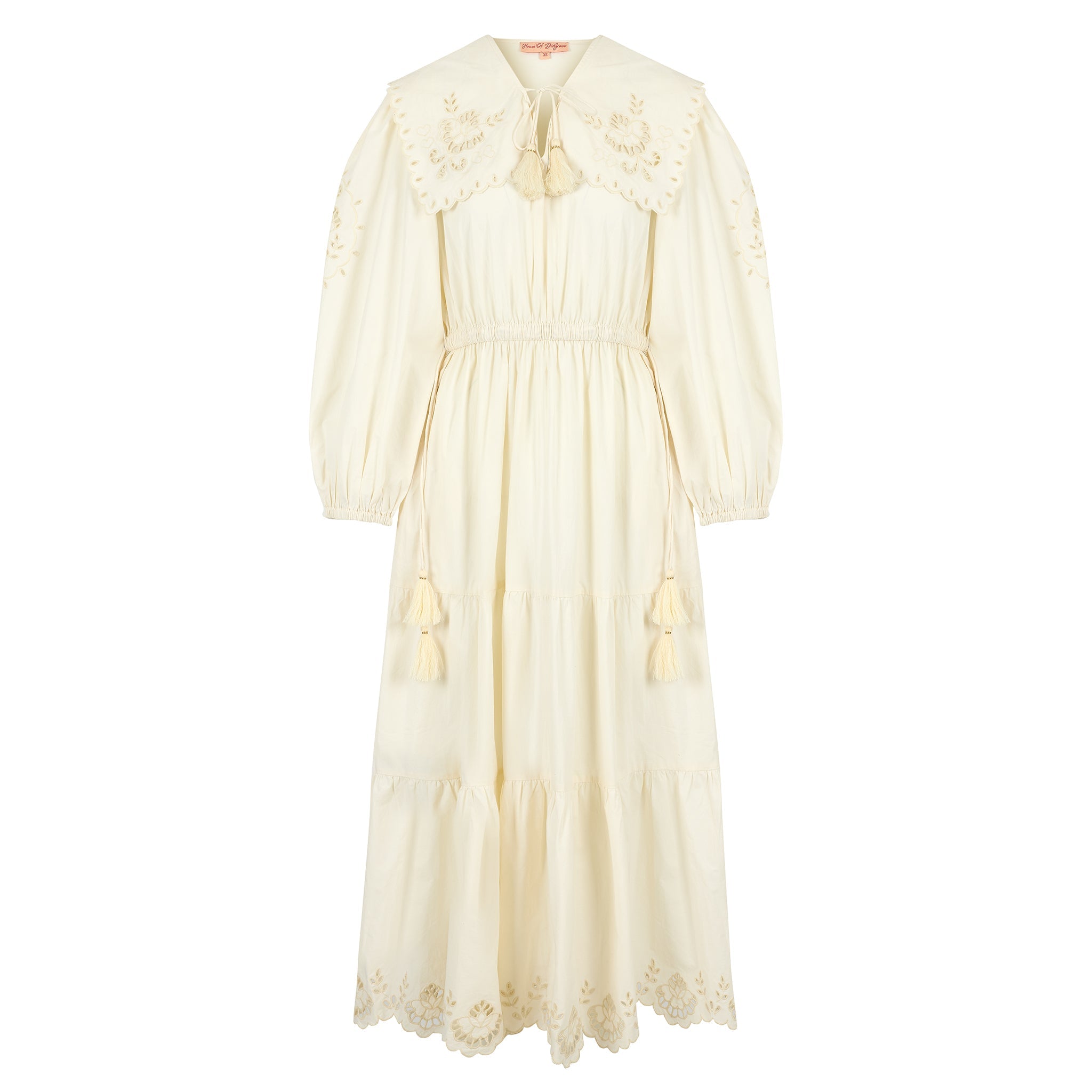 Woman wearing a summer maxi dress with an oversized collar and cinched waistline, styled in soft natural light.