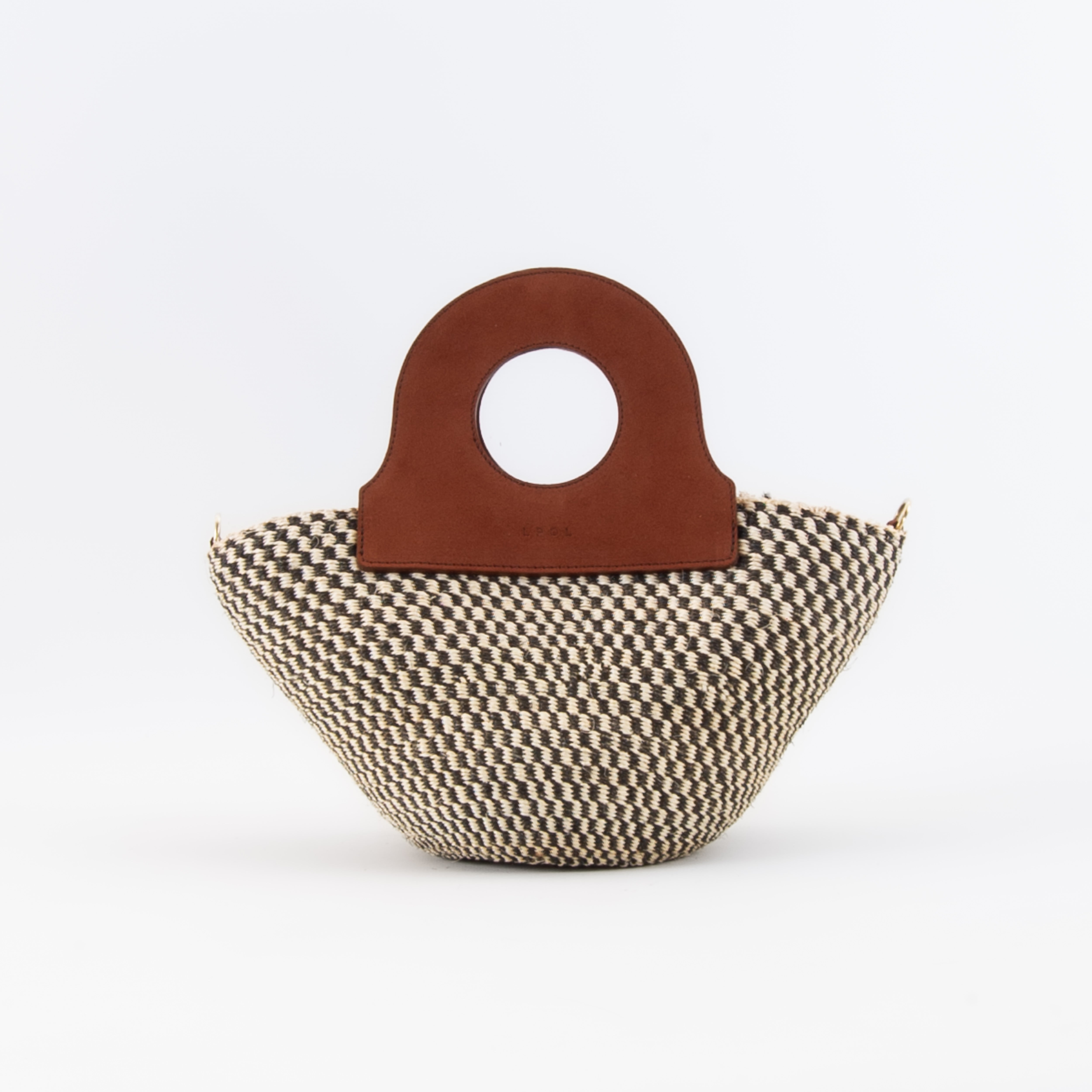 Handwoven basket bag featuring sturdy upcycled leather handles.