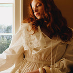 Back view highlighting the tiered maxi skirt and lightweight cotton texture of the summer dress.