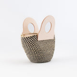 Handheld natural basket bag with sturdy handles, upcycled leather bag