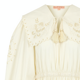 Product display of a tiered maxi skirt summer dress with embroidery and an oversized collar, shown flat against a neutral background.