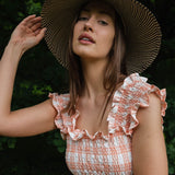 Lightweight cotton maxi summer dress with square neckline, shirred bodice, and delicate ruffle straps.