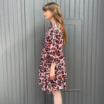 women wearing pink leopard dress side 