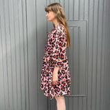 women wearing pink leopard dress side 