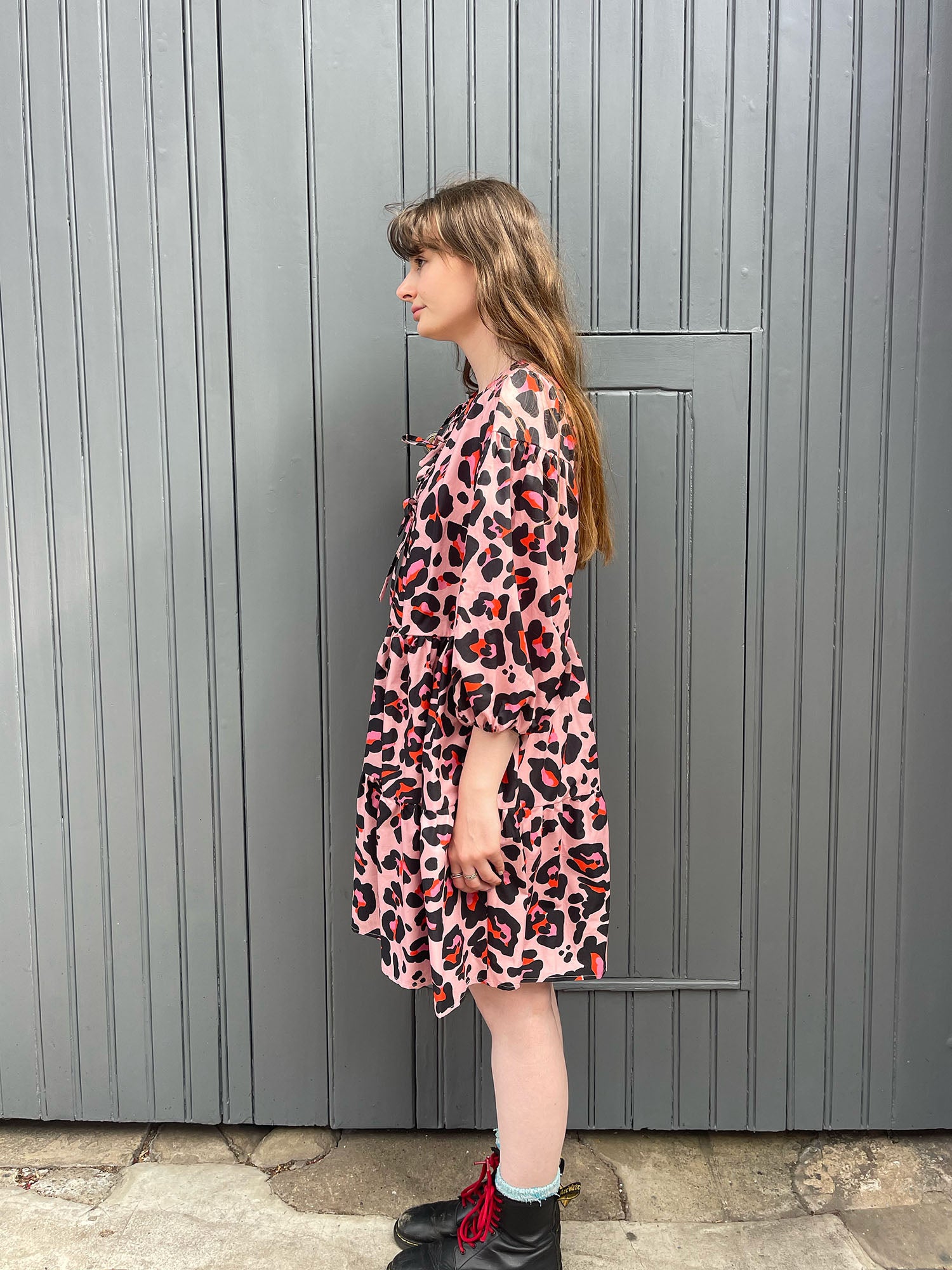 women wearing pink leopard dress side 
