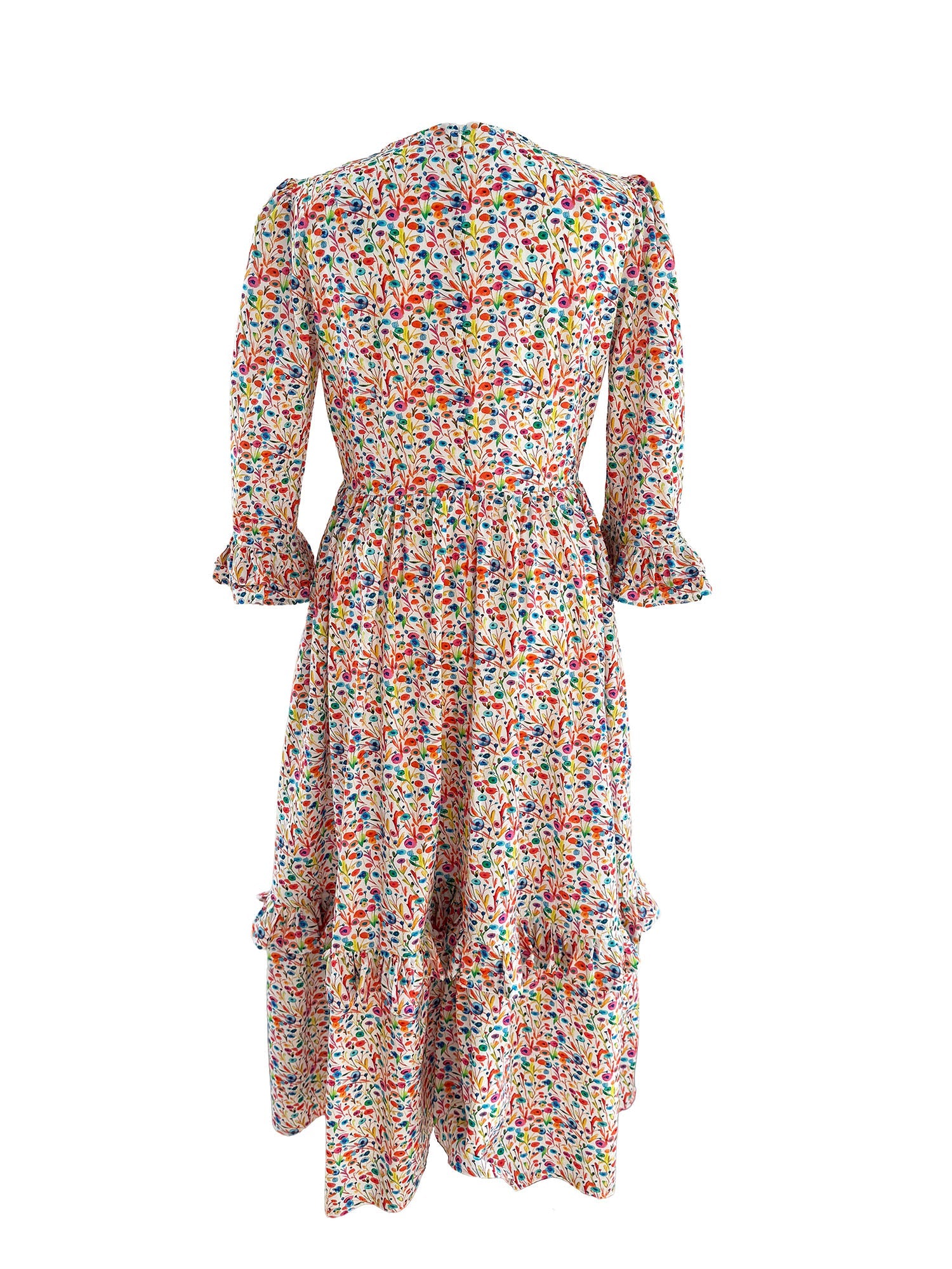 The Felicity Midi Dress in Rainbow Meadow print, made from sustainable cotton with a fitted bodice, full skirt, and stylish ruffled cuffs.