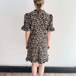 Back view of The Peony Dress showing soft structure and swingy silhouette.