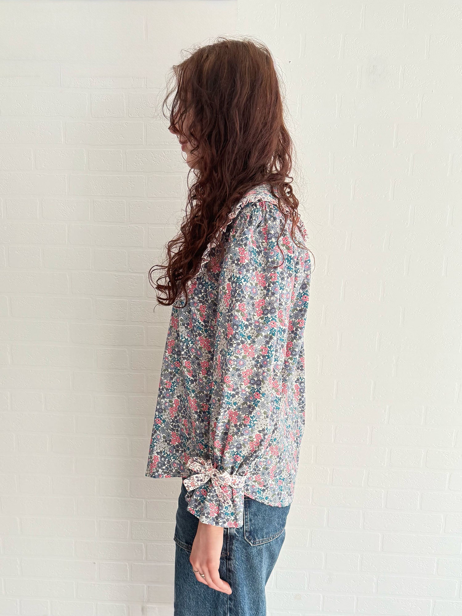 Sustainable vintage-inspired floral blouse with oversized collar and bow-detail cuffs
